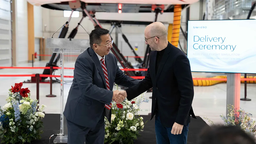 Handshake between CSS Chairman Ji Guangping and Simaero CEO Nicolas Mouté at A320 Level D full flight simulator delivery ceremony in Paris 17815141801981499.webp