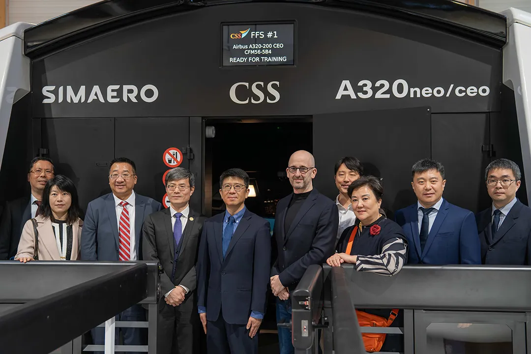 Sino-French delegates group portrait beside CSS A320 Level D FFS at Simaero delivery event Sino-French delegates group portrait beside CSS A320 Level D FFS at Simaero delivery event