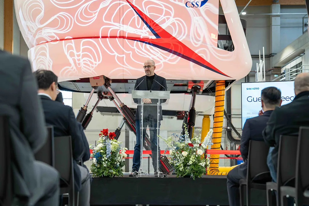 Simaero CEO Nicolas Mouté speaking beneath CSS A320 Level D FFS at Paris delivery event Simaero CEO Nicolas Mouté speaking beneath CSS A320 Level D FFS at Paris delivery event